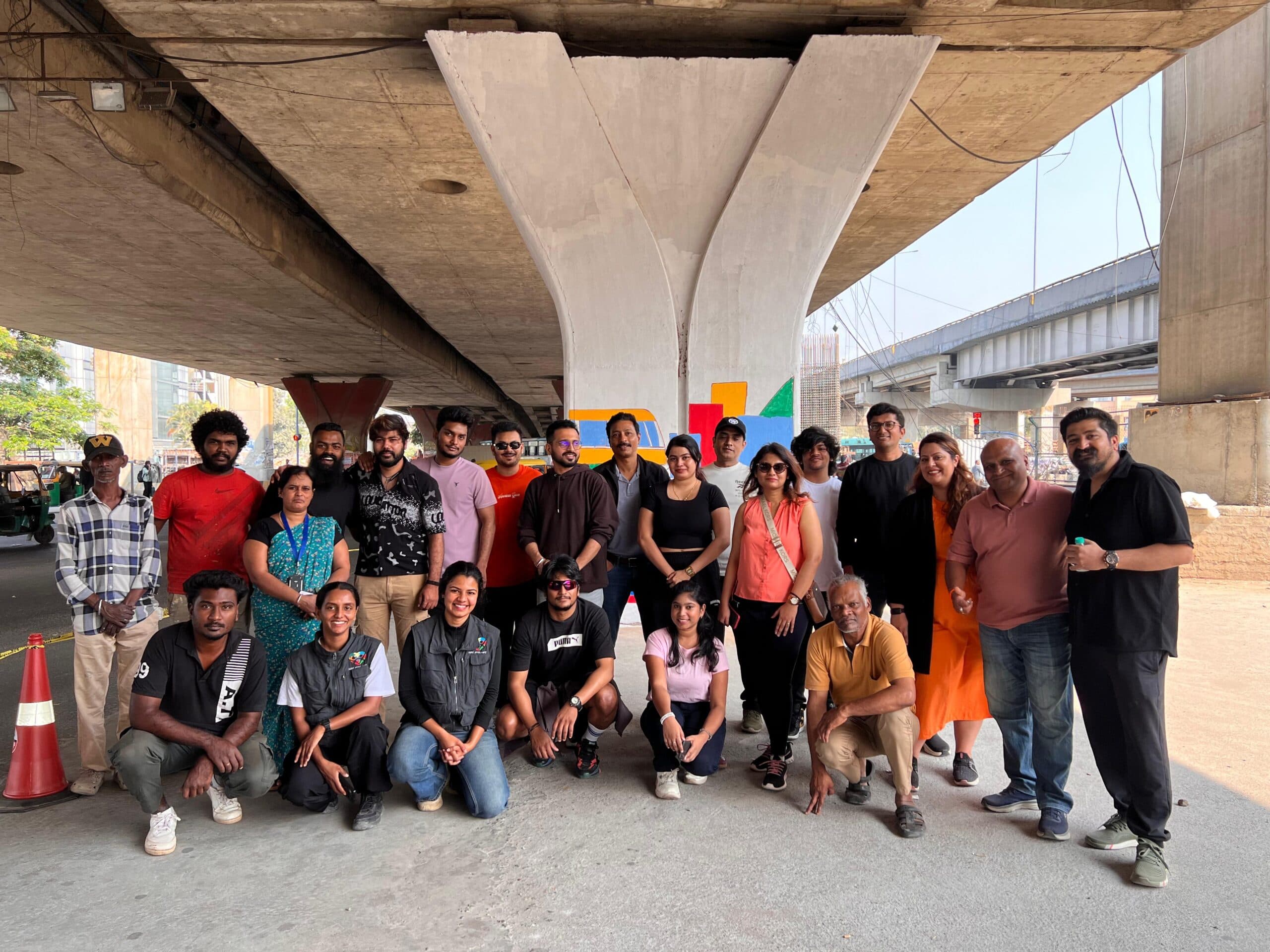 TapMind volunteers gathered beneath the Silk Board underpass