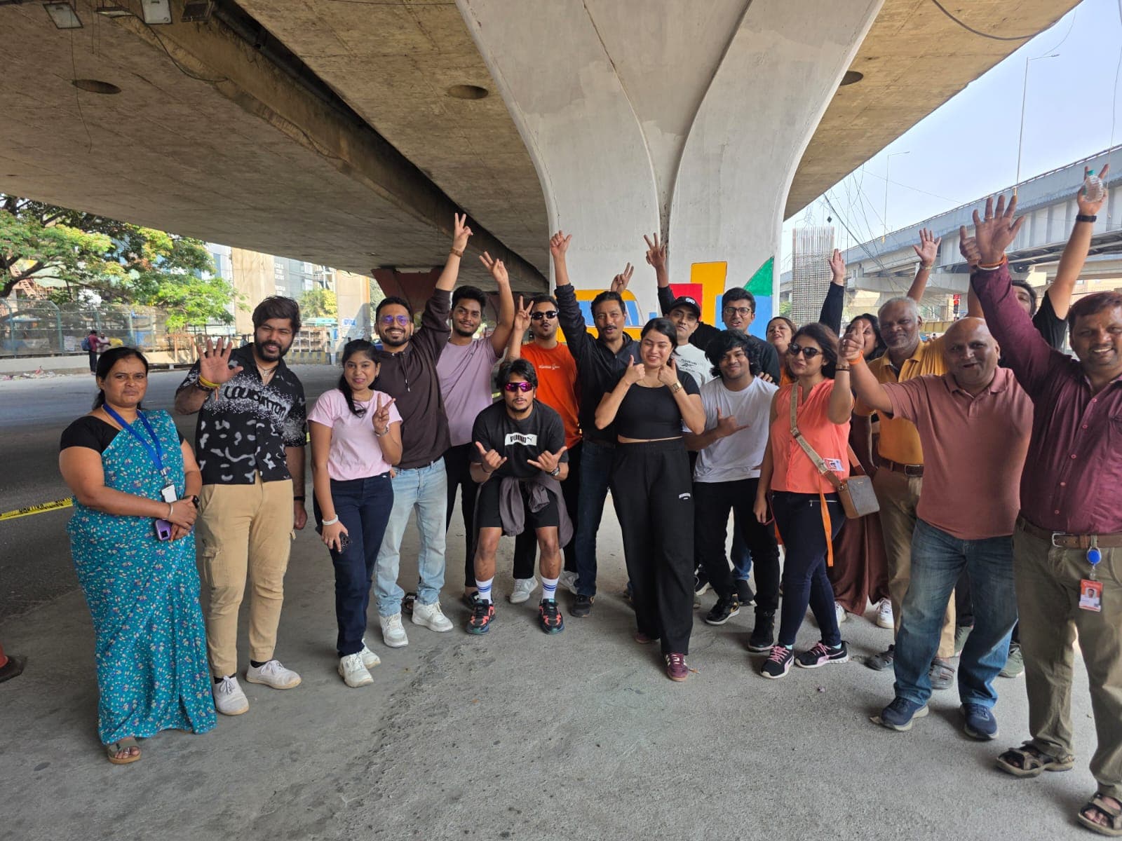TapMind volunteers celebrating the underpass beautification activity