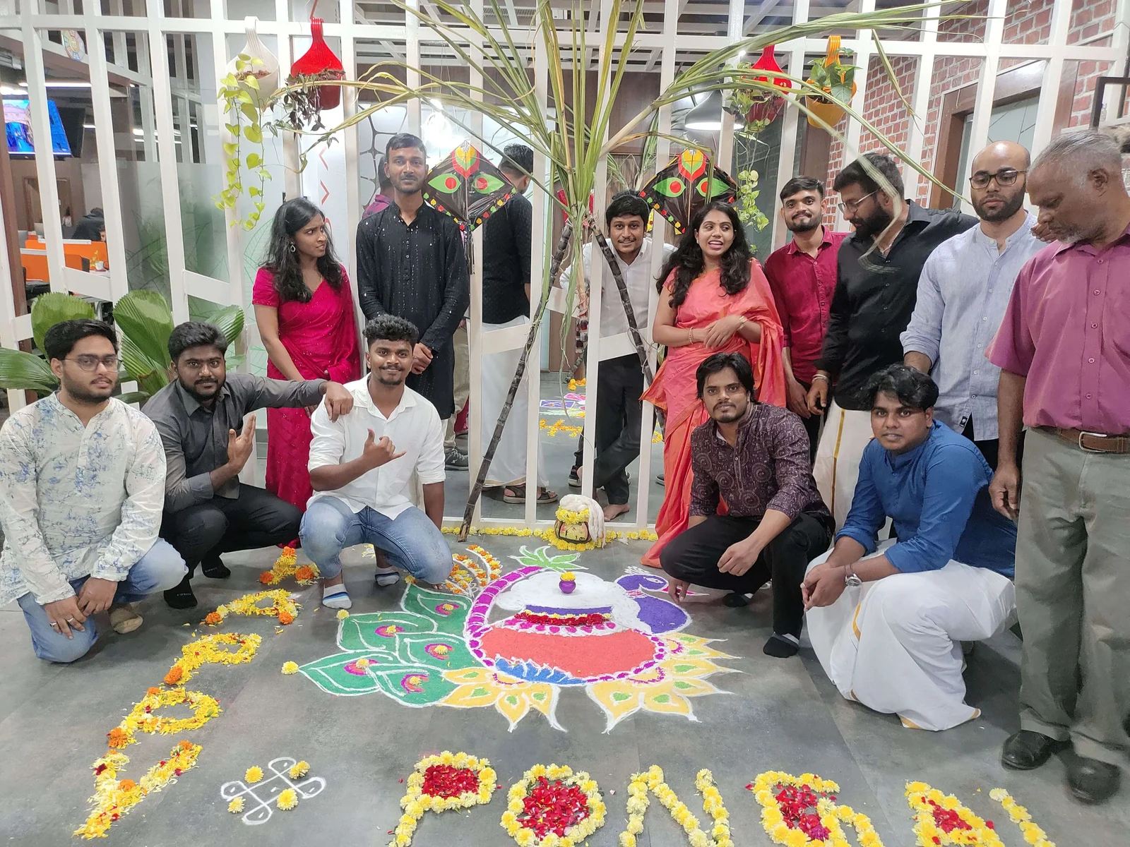 Team gathered around festive office decorations
