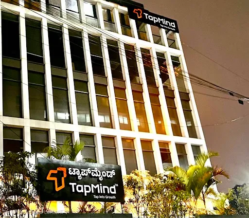 TapMind office building and signage at night