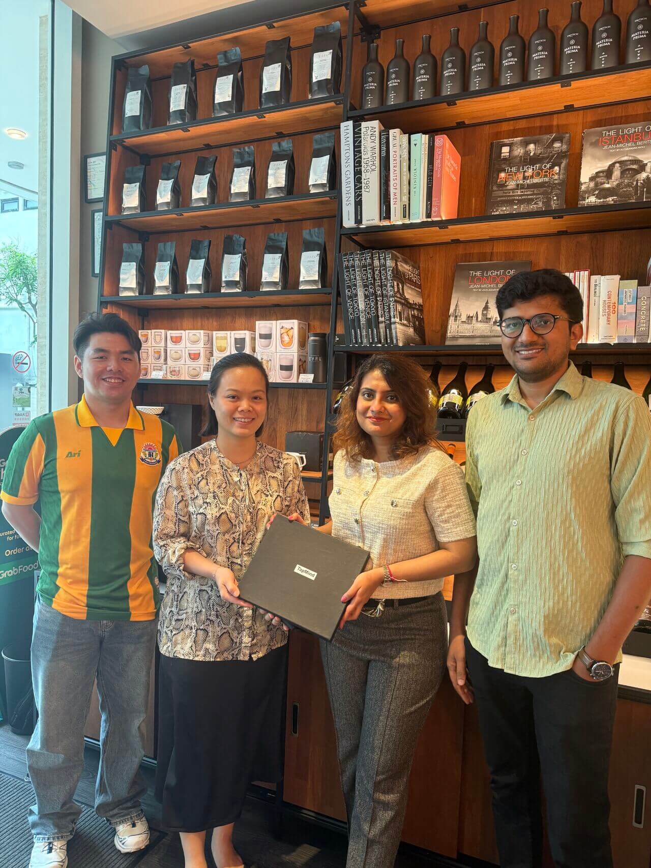 Team members presenting a gift at a gathering